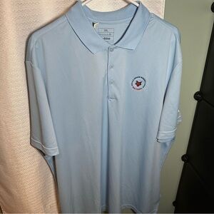 Fox chapel golf course. Blue Polo Shirt with Classic Collar and Emblem